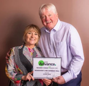 Henry Jones and Jackie proudly holding a "Barrie Advance Readers' Choice Awards 2019" certificate for the Antiques Mall.